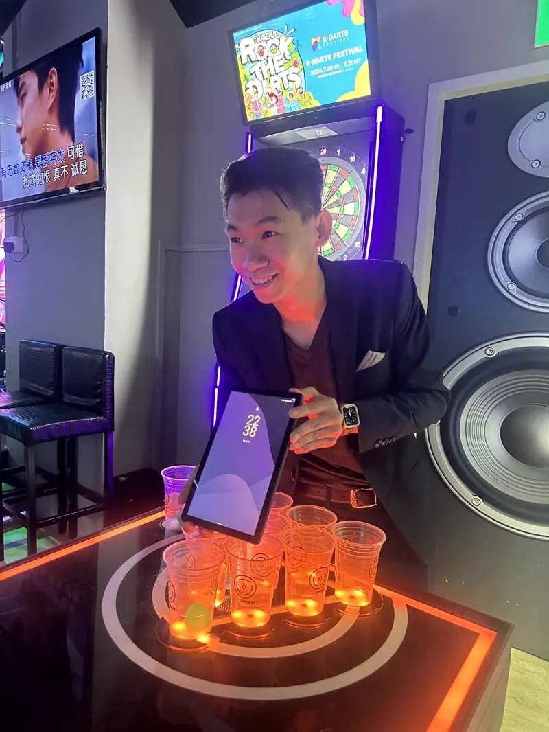 Electronic dartboards and a glowing LED beer pong table in the games corner at Major 99